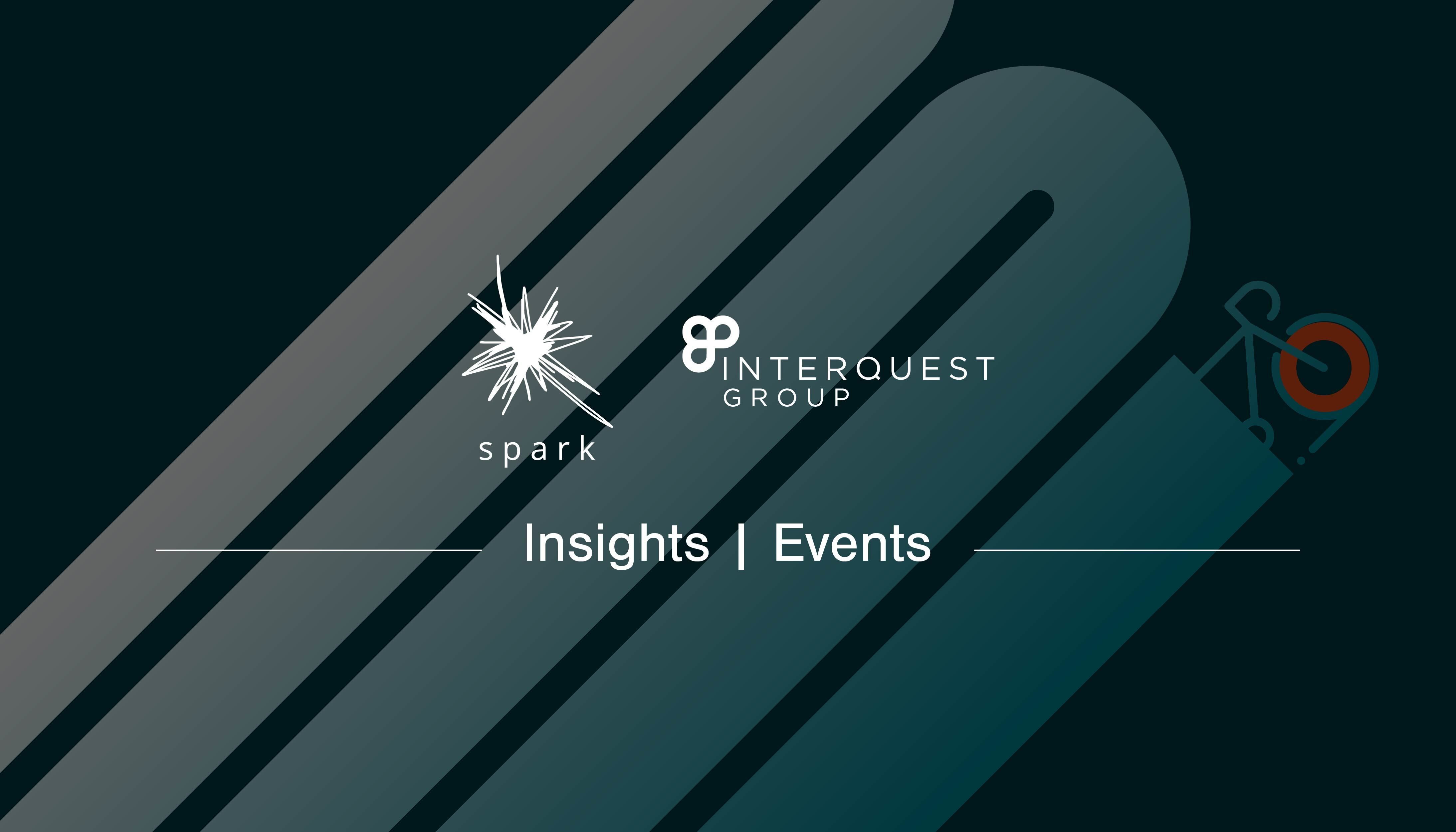 Event blog banner Spark and InterQuest Group logos in white on a graphic of a bicycle painting a route