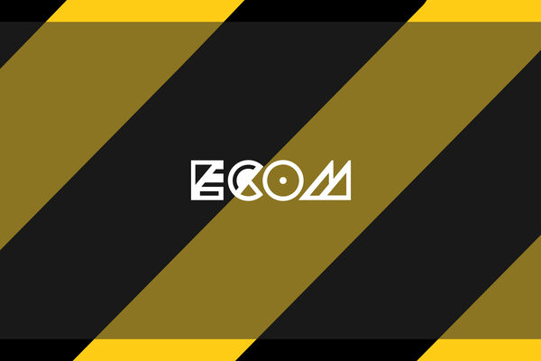 White ECOM logo on a Hack Manchester banner