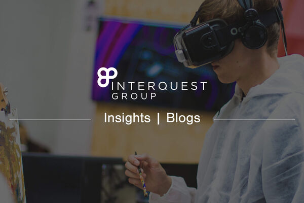 InterQuest Group insights banner with an image of a person using a virtual reality headset