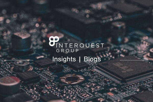 InterQuest Group blog header, close-up photo of a circuit-board as the background