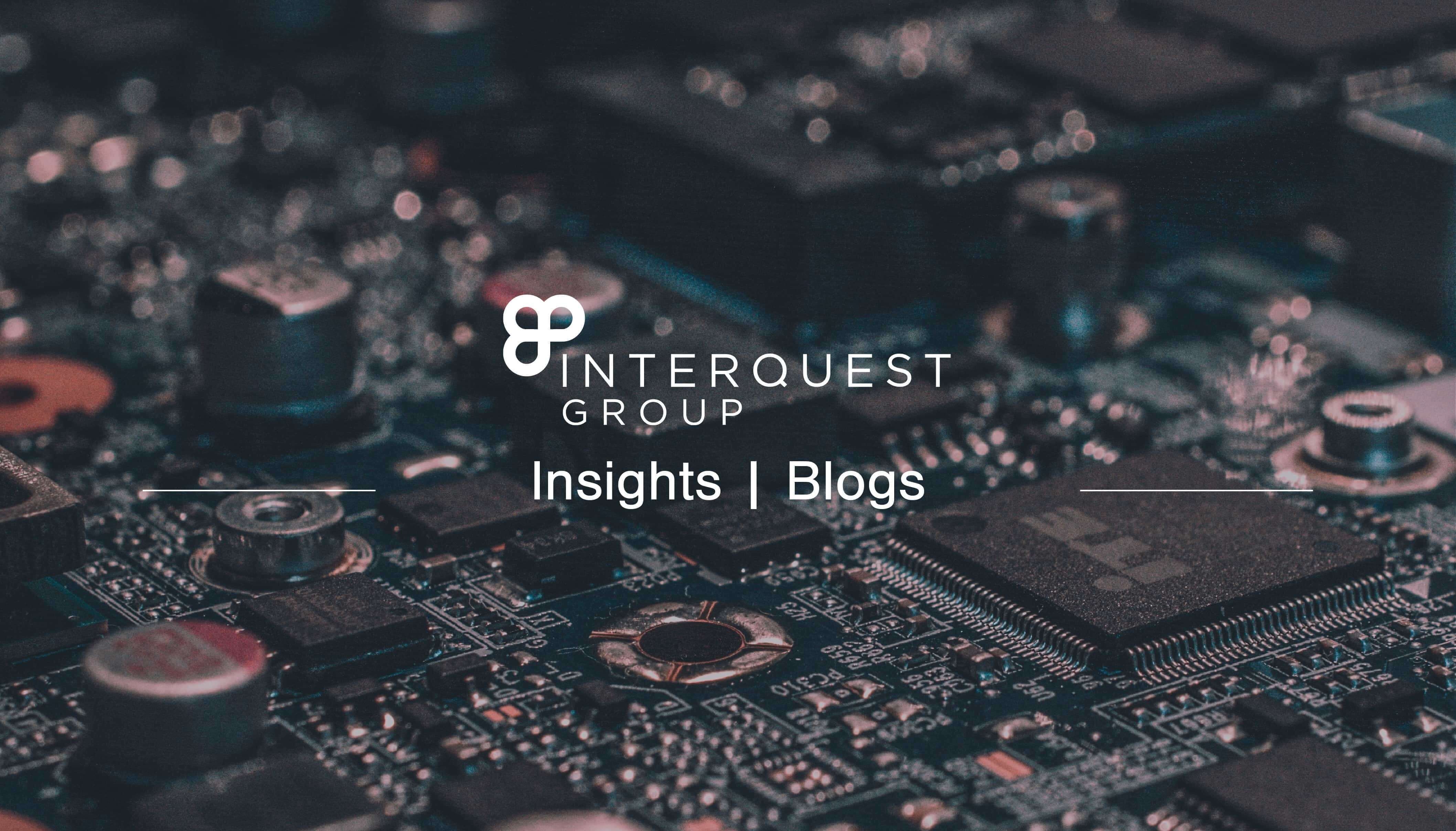 InterQuest Group blog header, close-up photo of a circuit-board as the background