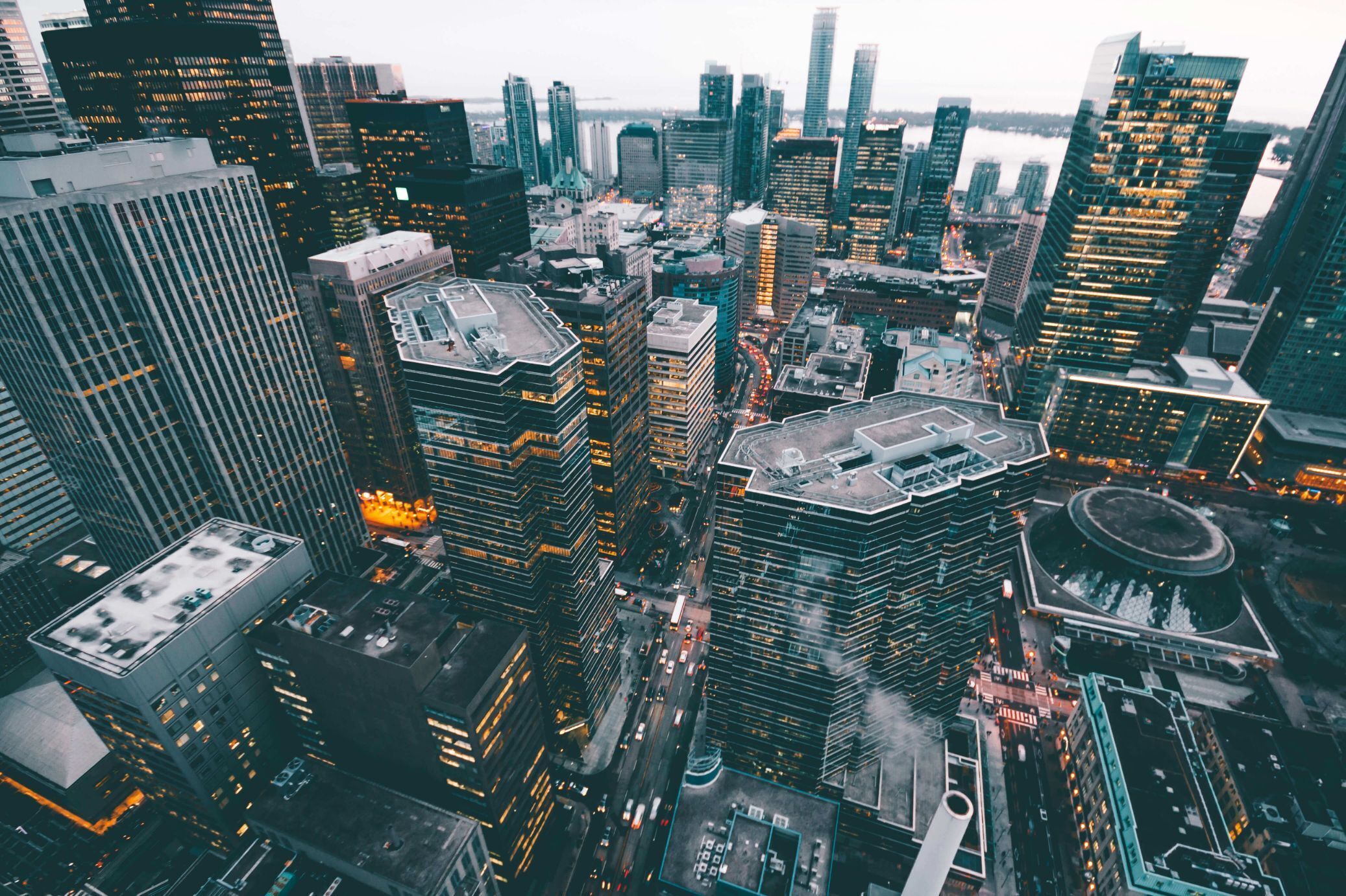 A city view from above on a cloudy day warm yellow glow from building lights