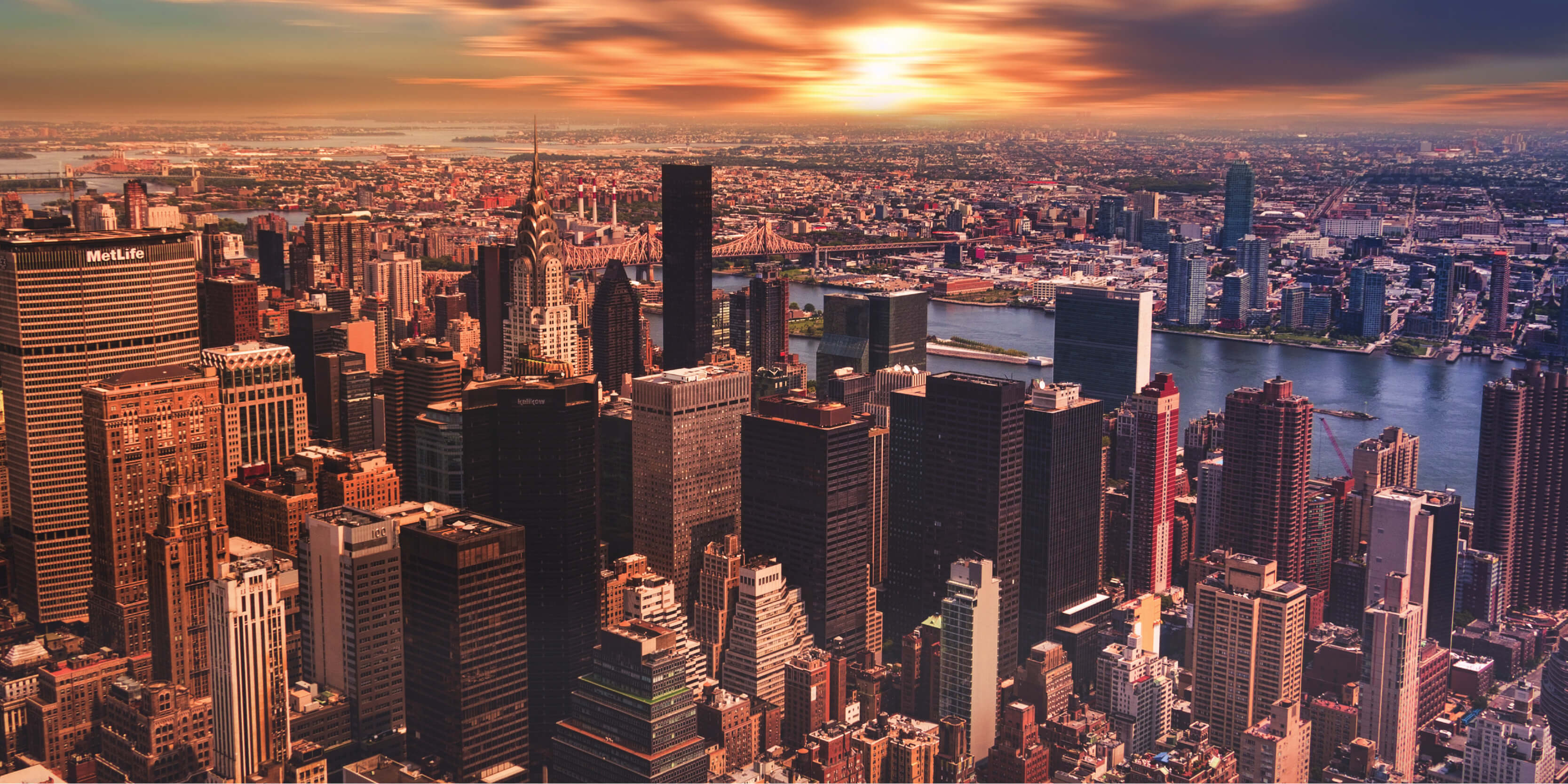 A photo of New York City skylines at sunset